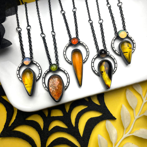 Amber & Sunstone Orbit Necklaces - 3 left: A, D & E
