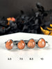 Orange Glow Rings with Volcanic Sand - size 8.5 left