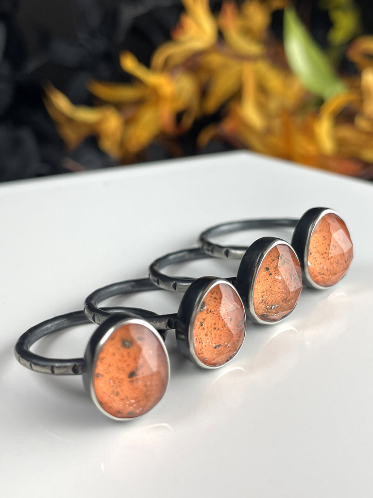 Orange Glow Rings with Volcanic Sand - size 8.5 left