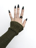 Pointy black ouija board ring displayed on a gothic model hand with long black nails. 3d printed jewelry by Hypnovamp.
