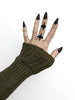 3d printed black atomic starburst ring worn by a gothic model with long black nails and a brown sweater. Mid-century style atomic jewelry by Hypnovamp.