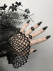 Matte black 3d printed eye ring displayed on a gothic model hand with long black nails