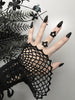 Pointy black ouija board ring displayed on a gothic model hand with long black nails. 3d printed jewelry by Hypnovamp.