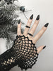 Cute 3d printed black heart ring displayed on a gothic model hand with long black nails