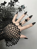 3d printed black atomic starburst ring worn by a gothic model with long black nails. Mid-century style atomic jewelry by Hypnovamp.