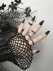 Zoomed out view of 4 minimalist matte black rings with white swarovski crystal stones, displayed on a gothic model's hand with long black nails. 3d printed jewelry by Hypnovamp.
