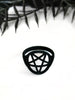 3d printed black pentagram ring displayed on white background with black foliage. Witchy jewelry by Hypnovamp.