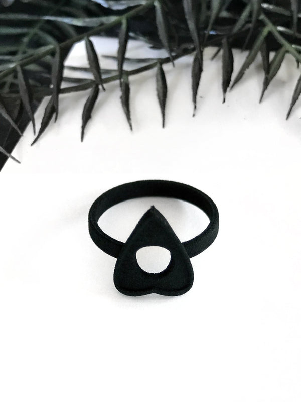 Pointy black ouija board ring on a white background with dark gothic foliage around the border. 3d printed jewelry by Hypnovamp.