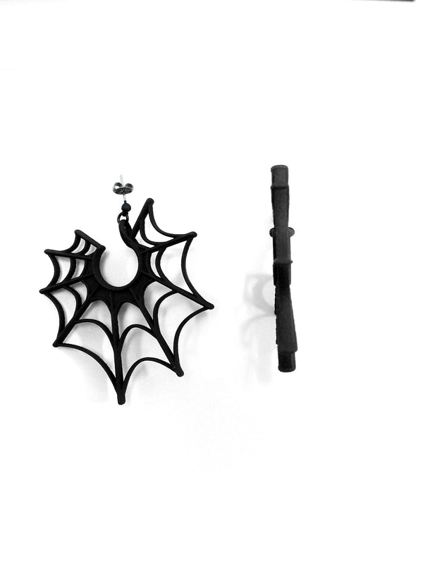 Side view. Large black spiderweb earrings displayed against a white background. 3d printed jewelry with hypoallergenic stainless steel posts.