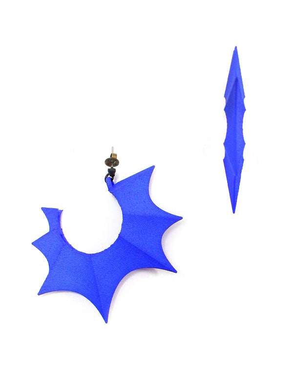 Side view. Big bright cobalt blue bat wing hoop earrings displayed on a white background. 3d printed jewelry by Hypnovamp.