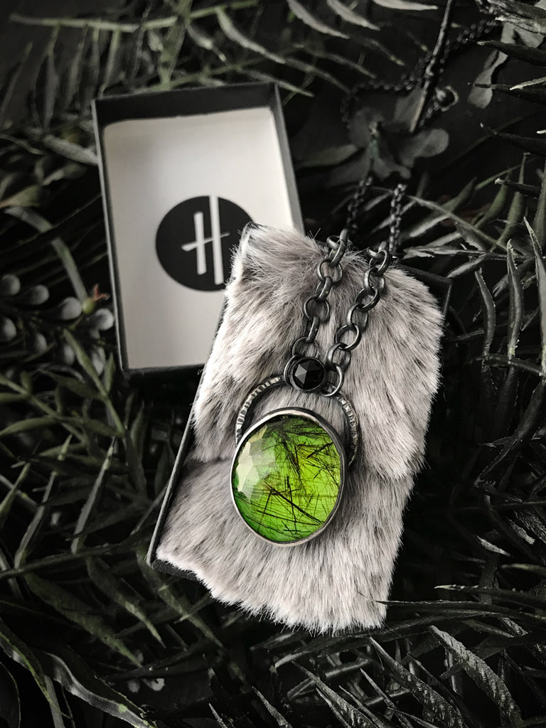 Crystal Ball Pendant with Glowing Green Rutilated Quartz