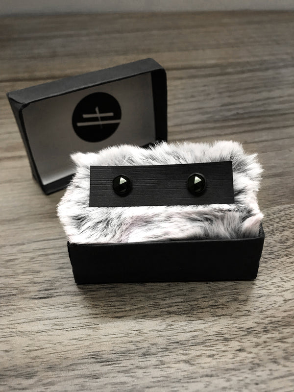 Witchy style stud earrings featuring oxidized sterling silver & rose-cut black spinel. Displayed in black jewelry box with grey fur. Minimalist gothic jewelry handmade in Salem, MA by jewelry designer Hypnovamp.