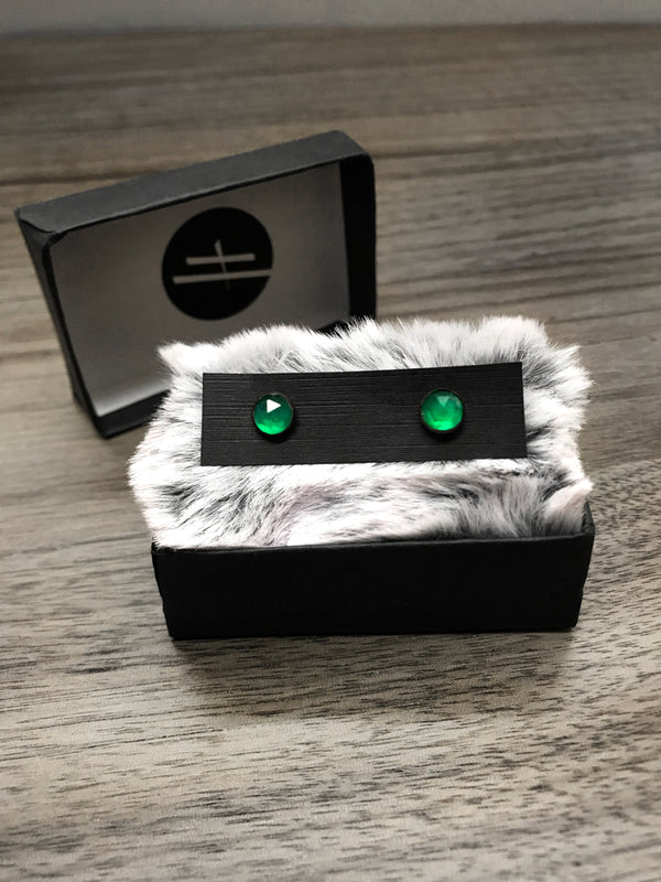 Witchy style stud earrings featuring oxidized sterling silver & rose-cut green onyx. Displayed in black jewelry box with grey fur. Minimalist gothic jewelry handmade in Salem, MA by jewelry designer Hypnovamp.