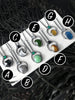 Alphabetical product labeling on top of handmade silver gemstone necklaces featuring black onyx, midnight quartzite, clear quartz moon, chrysoprase, chrome diopside, petra tourmaline, montana agate, and blue apatite. Witchy jewelry handcrafted in Salem Massachusetts by jewelry designer and silversmith Hypnovamp.
