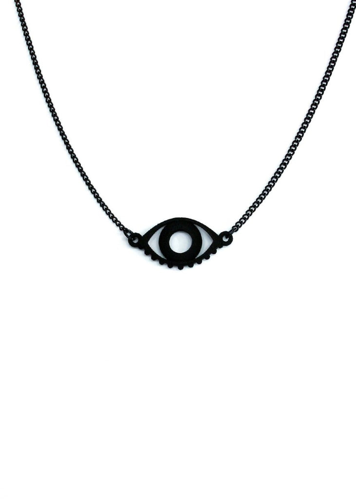 Matte black evil eye necklace displayed on a white background. Witchy black 3d printed jewelry by Hypnovamp.